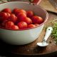a bowl full of nice cherry tomatoes, vegetable, and fruit rustically depicted, simple and delicious